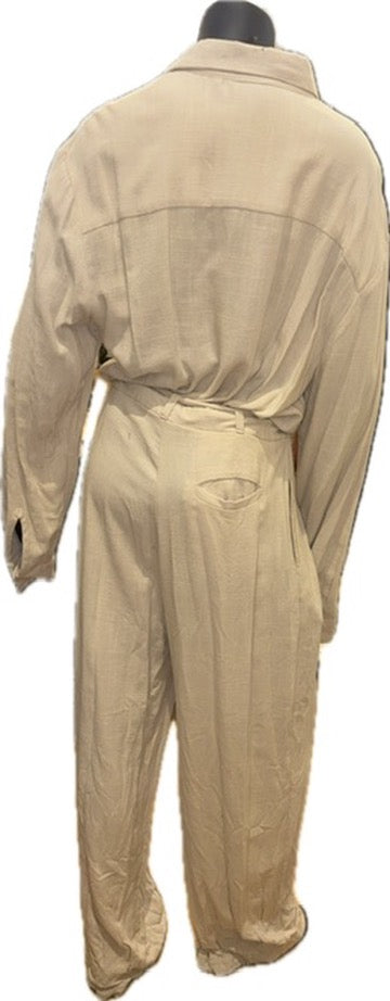 A beige one-piece jumpsuit or coverall displayed on a black mannequin torso, showing the back view against a plain white background.