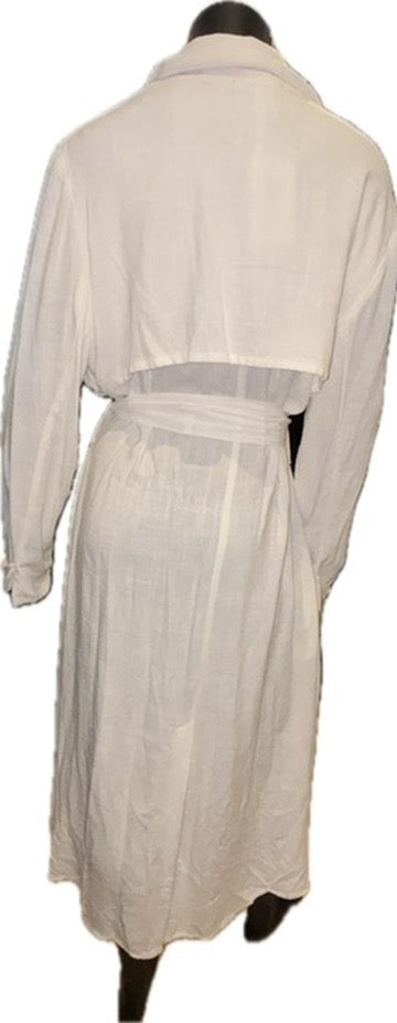 A white long-sleeve shirt dress or robe with a tie waist belt, shown from the back on a black mannequin against a white background.
